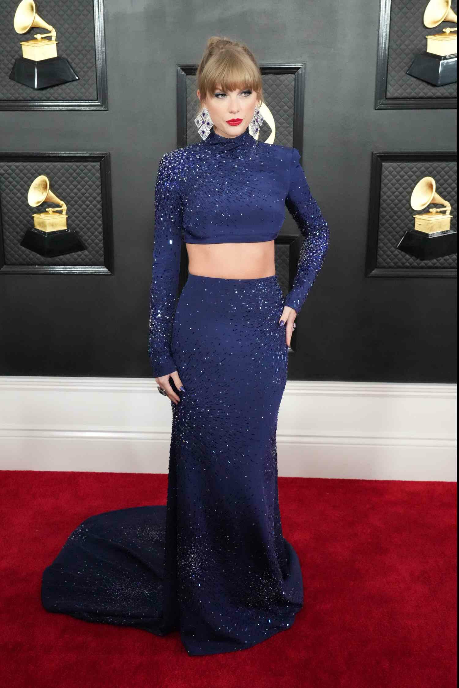 Taylor Swift Blue Bedazzled Two-Piece Top and Skirt Hand on Hip 2023 Grammys