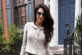 Amal Clooney in a light gray tweed skirt suit