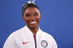 Simone Biles of Team United States smiles during the Women's Team Final on day four of the Tokyo 2020 Olympic Games