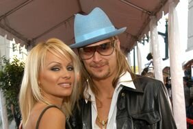 Pam Anderson and Kid Rock posing together on the red carpet