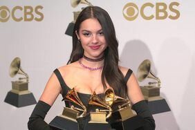 Olivia Rodrigo Holding Grammy Awards at 2022 Grammys