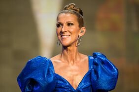 Celine Dion Looking to the Side Smiling Blue Dress with Puff Shoulders Hair in a Bun at Barclaycard Presents British Summer Time Hyde Park in London