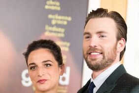 Jenny Slate and Chris Evans in formalwear posing together at an event