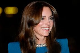 Kate Middleton Smiling Curled Hair Blue Dress
