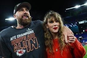 Travis Kelce Tongue Out Arm Around Taylor Swift Who Holds His Hand on the Field After AFC Championship Against Baltimore Ravens