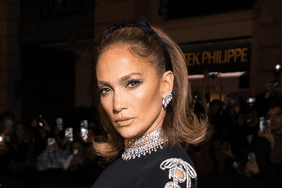 Jennifer Lopez wearing diamond earrings and hair bow
