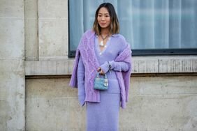 woman wearing a lavender dress and sweater