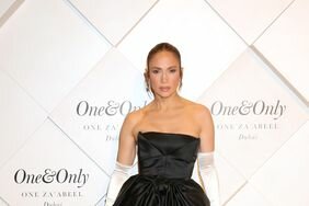 Jennifer Lopez Posing Arms By Side Black Strapless Dress White Opera Gloves One&Only One Za'abeel Grand Opening Feb. 10, 2024