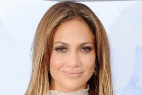 Jennifer Lopez with long, straight blonde highlights, nude lipstick, and shimmery brown shadow in 2016