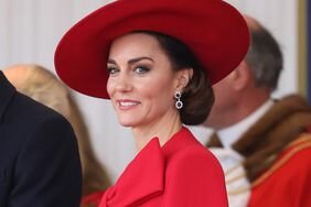 Kate Middleton Smiling Red Coat and Wide Hat at Ceremonial Welcome for The President and the First Lady of the Republic of Korea at Horse Guards Parade 
