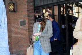 Dakota Johnson Wore Wide Leg Jeans with Sneakers