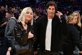 Ashley Benson and Brandon Davis Holding Up Peace Signs at Los Angeles Lakers Game