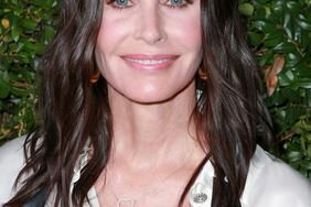 Courteney Cox long, glossy waves and pink monochromatic makeup