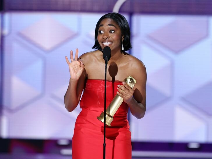 Ayo Edebiri giving her acceptance speech at the 2024 Golden Globes wearing a red dress