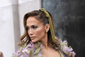 Jennifer Lopez wearing a bow in her hair at Paris Fashion Week