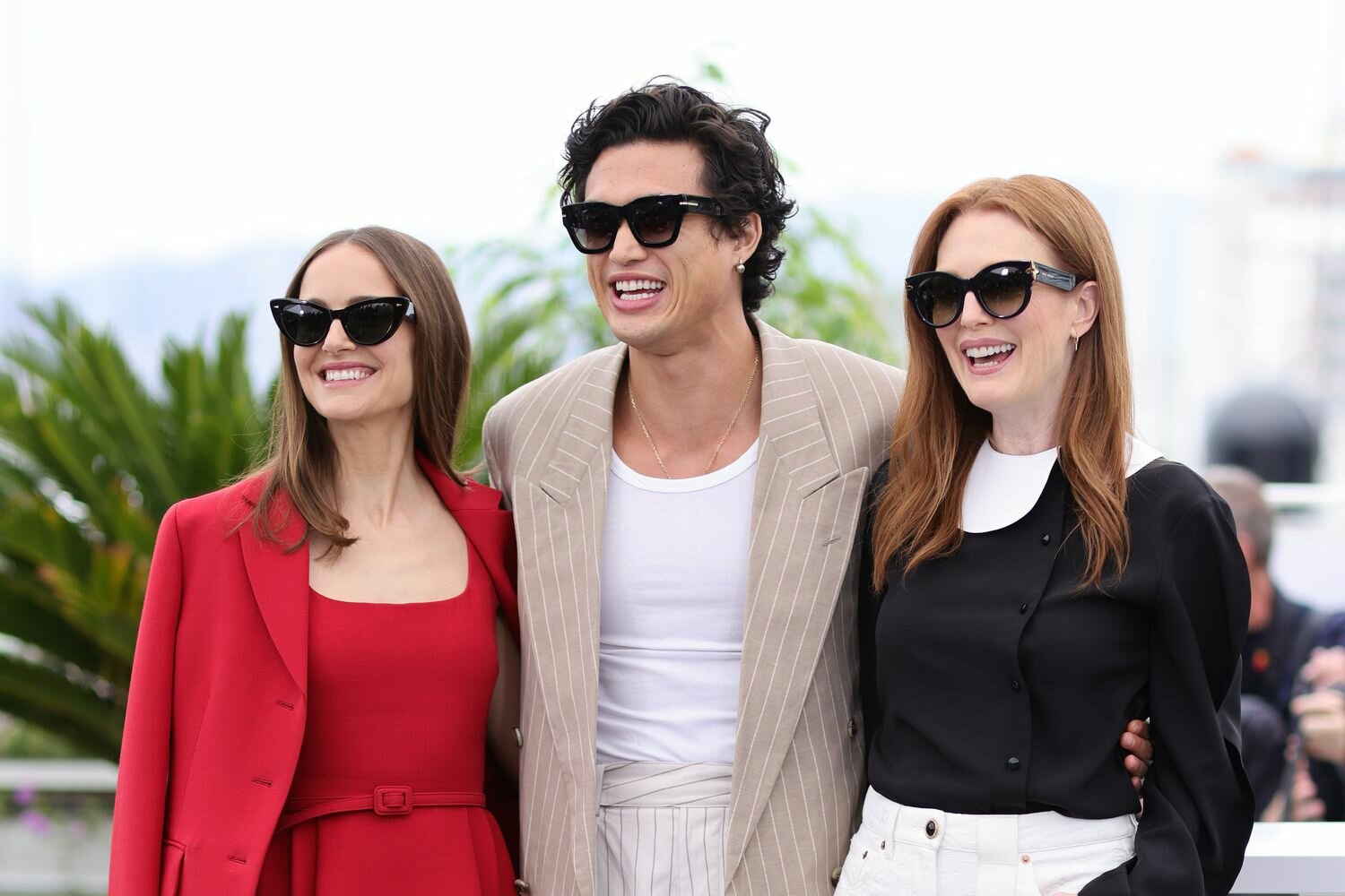 Natalie Portman, Charles Melton and Julianne Moore attend the "May December" photocall at the 76th annual Cannes film festival