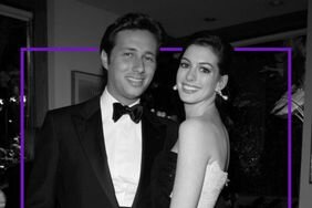 Anne Hathaway wearing a formal gown with her arms around, Raffaello Follieri, who is wearing a tuxedo