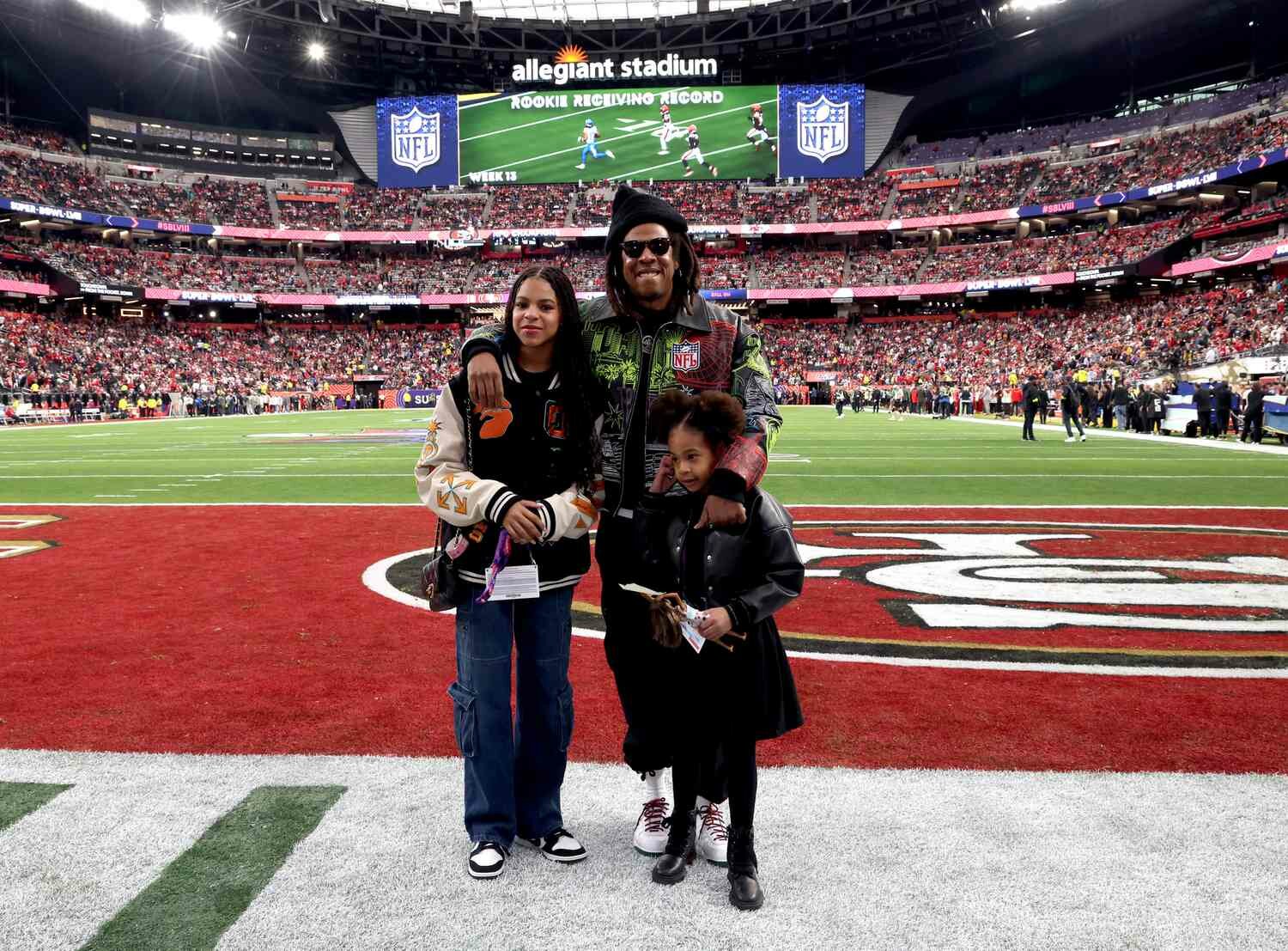 Blue Ivy Carter, Jay-Z and Rumi Carter attend the Super Bowl