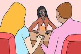 Illustration of a couple holding hands while talking to a therapist