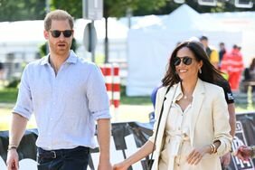 Prince Harry and Meghan Markle Holding Hands at 2023 Invictus Games
