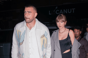 Travis Kelce Taylor Swift holding hands and walking