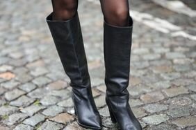 A woman wearing knee high boots