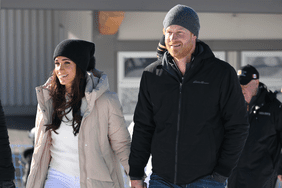 Prince Harry and Meghan Markle attend the Invictus Games in coats and hats