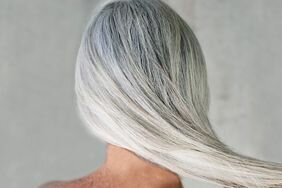 Backside of someone with long, straight gray hair