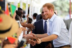 Prince Harry is greeted upon arriving to Charlestown on the Island of Nevis on the fourth day of an official visit on November 23, 2016 in Saint Kitts and Nevis. Prince Harry's visit to The Caribbean marks the 35th Anniversary of Independence in Antigua a