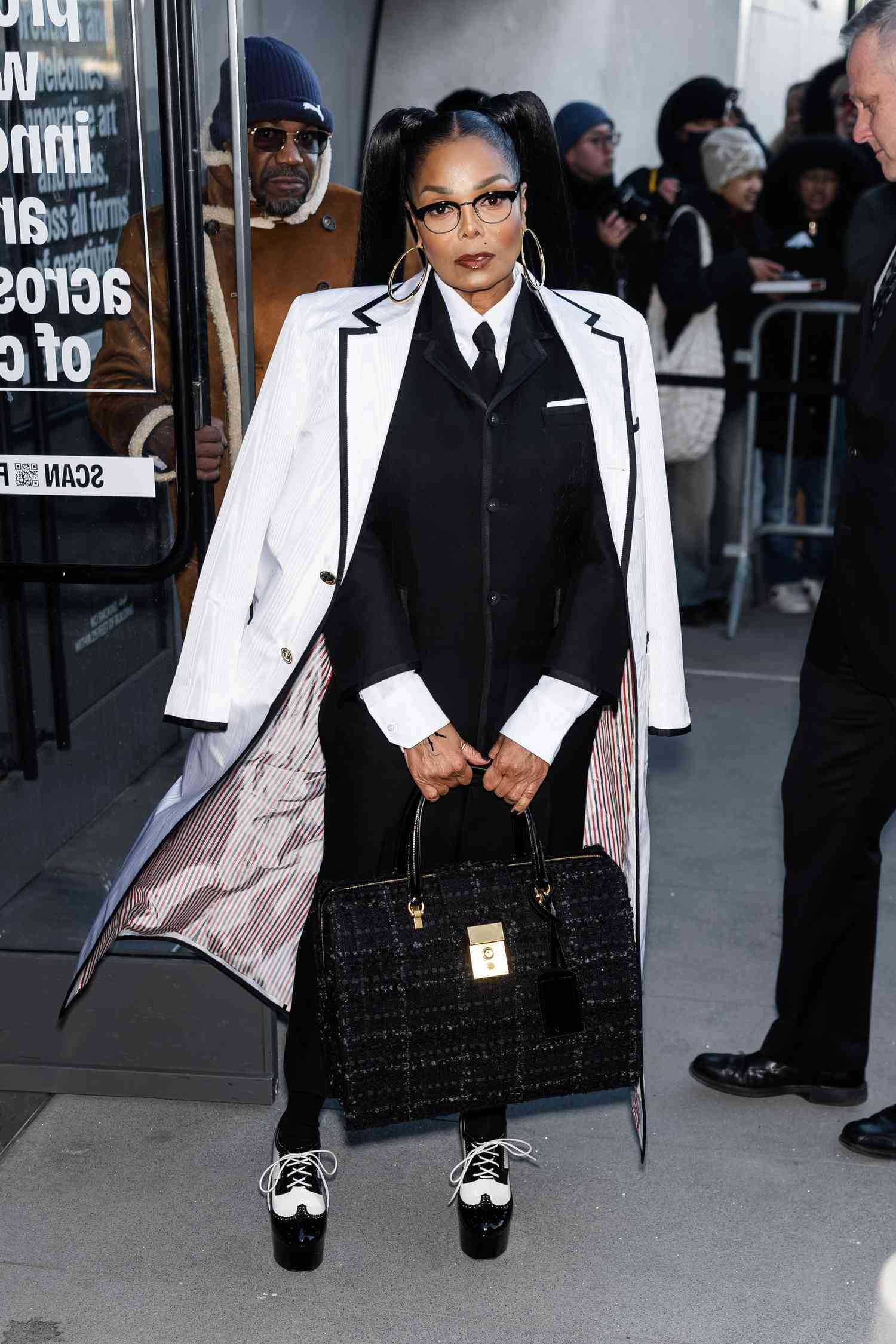Janet Jackson posing at Thom Browne fashion show 