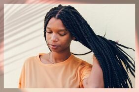 Black woman wearing long braids