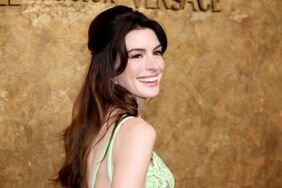 Anne Hathaway attends the Clooney Foundation For Justice's "The Albies" in a green dress