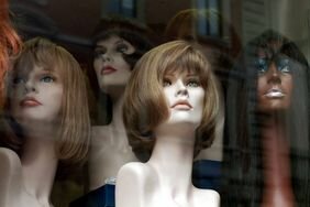 Display of mannequin heads with wigs