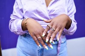 A woman showing off her gel nails.