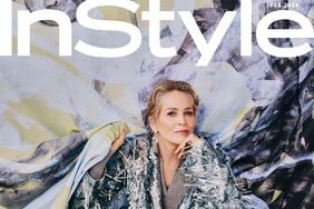 Sharon Stone InStyle February Cover crotching in front of green purple and black painting wearing a silver frayed suit