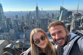 David and Harper Beckham Selfie Smiling in Front of New York City Skyline