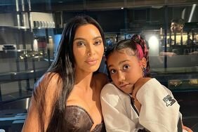 Kim Kardashian and North West Posed at Table North Leaning Into Kim Soft Smiles