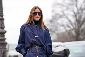Olivia Palermo in a denim maxi skirt and shirt with tapered sleeves