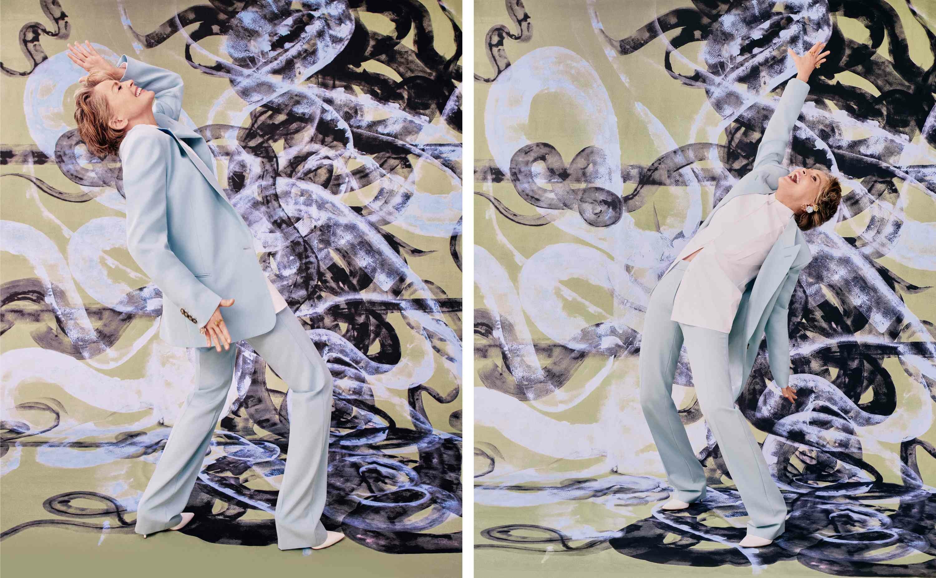 Sharon Stone Blue suit dancing in front of a green black and periwinkle painting