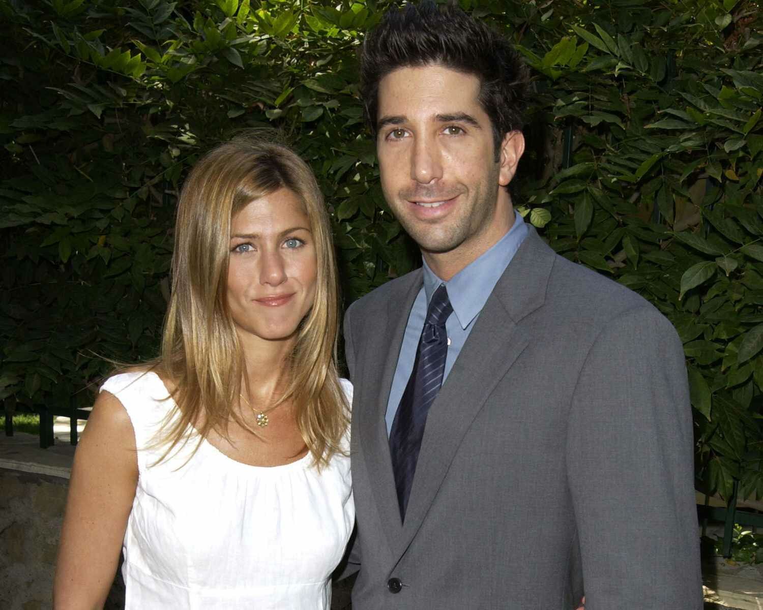 Jennifer Aniston Soft Smile Hand in Pocket and David Schwimmer Smiling in Suit 2003