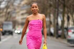 A woman wears a pink strapless dress