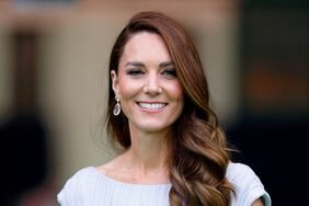 Kate Middleton with long, wavy hair and drop earrings