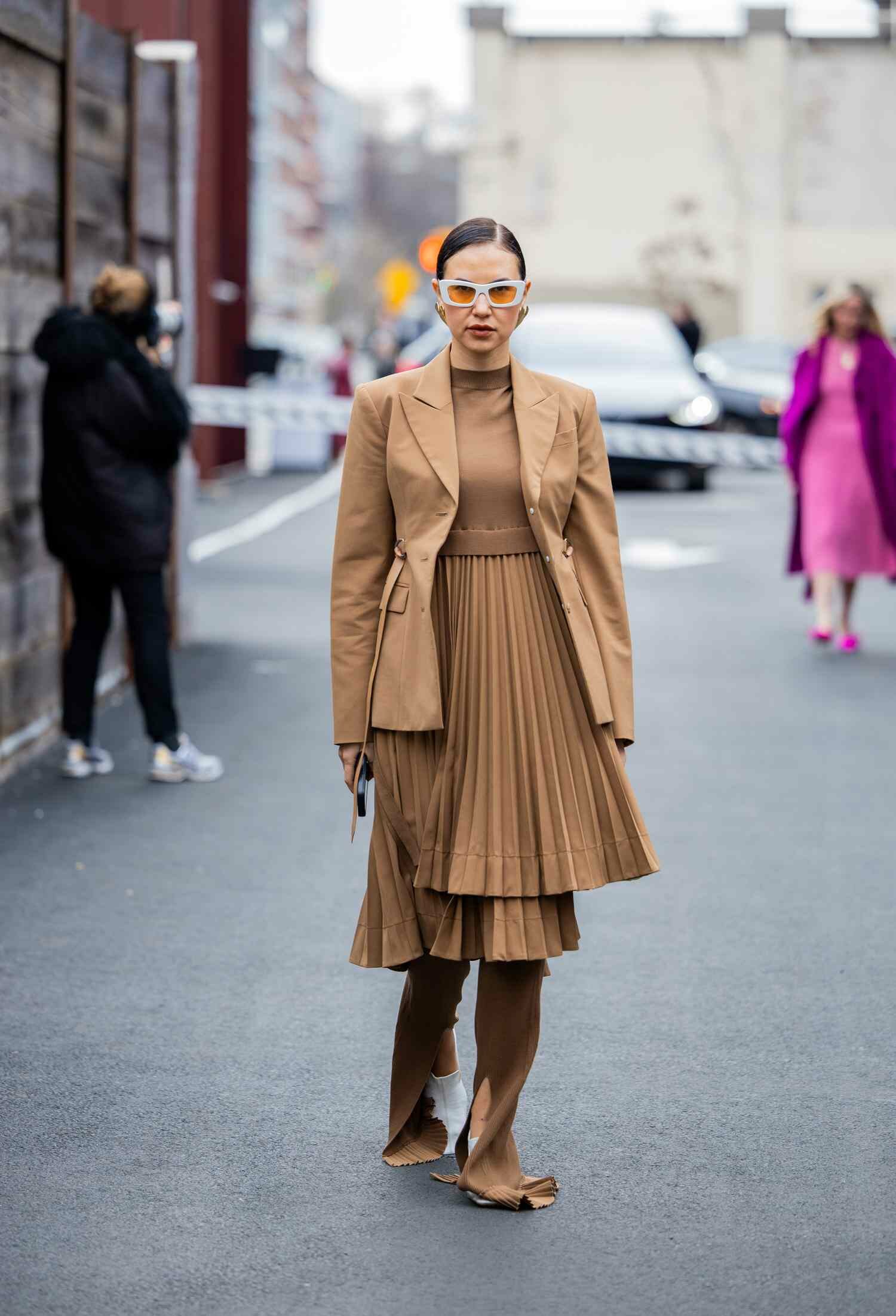 A guest wears an all brown look, one of the best 2024 NYFW street style looks.