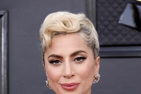 Lady Gaga with pinned up curls, a fresh face, and white liner