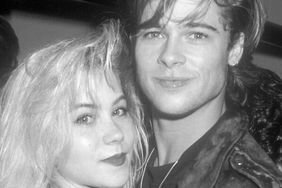 Christina Applegate posing with Brad Pitt in an embrace - black and white photo