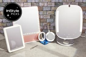 Four of the Best Lighted Makeup Mirrors sitting on a countertop against a tile wall