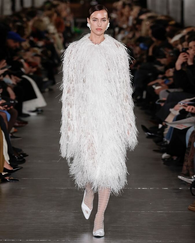 Irina Shayk Walking Tory Burch NYFW in White feather coat