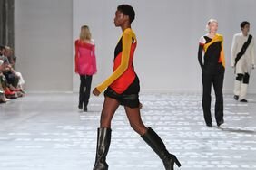 A NYFW model wears black boots, one of the best 2024 NYFW SS24 shoe trends.