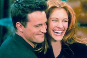 Matthew Perry embraces julia roberts on the set of friends